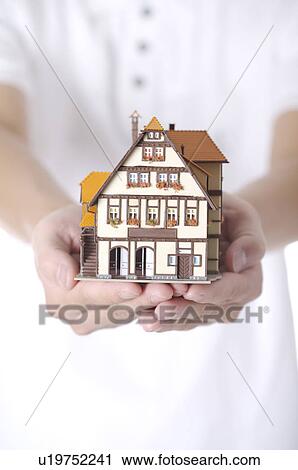 Toy Villa held in hands View Large Photo Image Stock Image - Toy Villa held in hands. Fotosearch