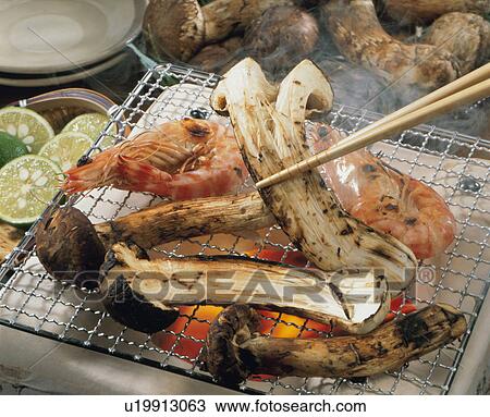 Stock Image - Charcoal Burner Of Matsutake. Fotosearch