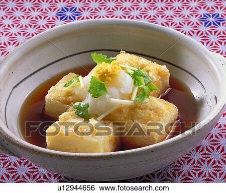 Stock Photograph - Deep-Fried Tofu With Amber Sauce. Fotosearch
