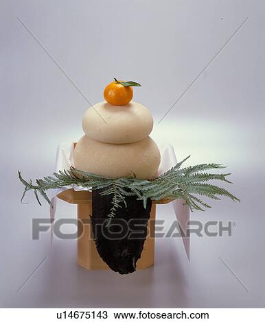 Stock Image - Round Rice Cake Offered To The Gods. Fotosearch