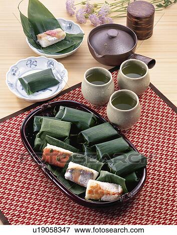 Stock Photo - Sushi Wrapped In Bamboo Grass. Fotosearch