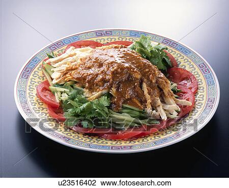 Stock Image - Boiled Chicken In Heated Sauce. Fotosearch