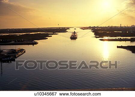Barge in Inland Waterway with Sun Reflection in Water View Large Photo Image Stock Photo - Barge in Inland Waterway with Sun Reflection in Water. Fotosearch