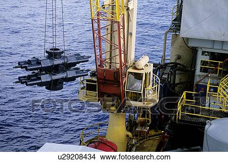 BOP Being Lifted on Offshore Oil Drilling Rig View Large Photo Image Picture - BOP Being Lifted on Offshore Oil Drilling Rig. Fotosearch
