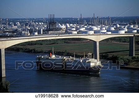 Stock Photo - Cargo Ship in Houston Ship Channel Passing Under Bridge. Fotosearch