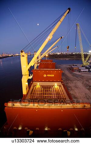 Crane Offloading Pipe from Cargo Ship View Large Photo Image Picture - Crane Offloading Pipe from Cargo Ship . Fotosearch