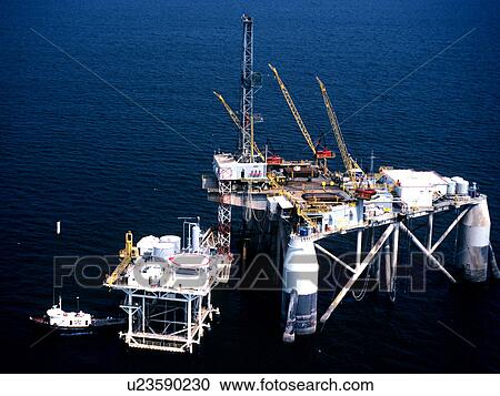 Early Generation Semisubmersible Offshore Oil Drilling Rig Working Over Production Platform View Large Photo Image Stock Image - Early Generation Semisubmersible Offshore Oil Drilling Rig Working Over Production Platform. Fotosearch