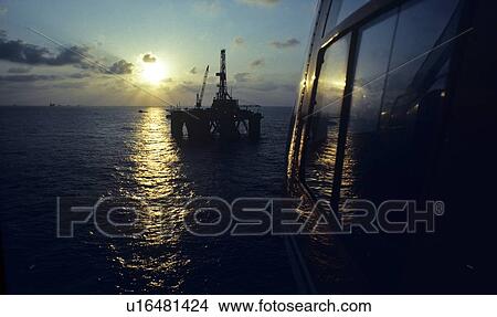 Helicopter Approaching Offshore Oil Drilling Rig View Large Photo Image Picture - Helicopter Approaching Offshore Oil Drilling Rig. Fotosearch