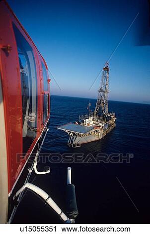 Stock Image - Helicopter Landing on Drillship. Fotosearch