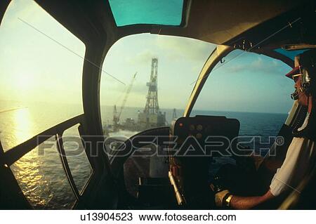 Stock Image - Helicopter Landing on Offshore Oil Drilling Rig. Fotosearch