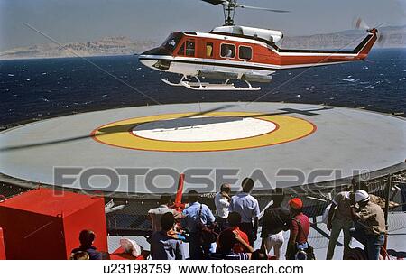 Helicopter Landing on Offshore Oil Drilling Rig View Large Photo Image Stock Photo - Helicopter Landing on Offshore Oil Drilling Rig. Fotosearch