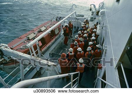 Stock Photograph - Lifeboat Safety Drill on Offshore Oil Drilling Rig. Fotosearch