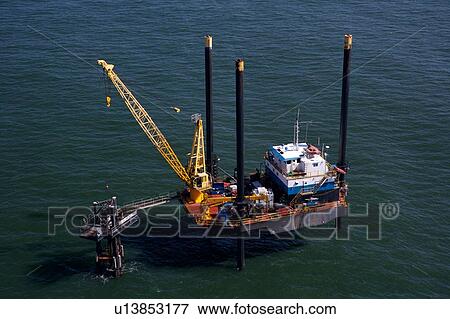 Stock Photo - Liftboat Performing Production Platform Maintenance. Fotosearch