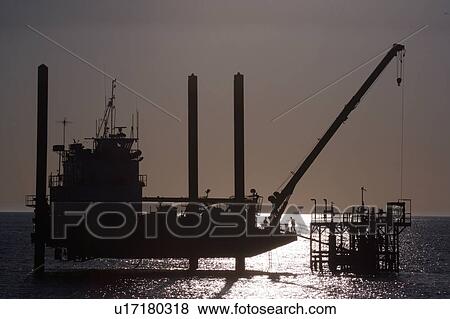 Stock Photo - Liftboat Performing Production Platform Maintenance. Fotosearch