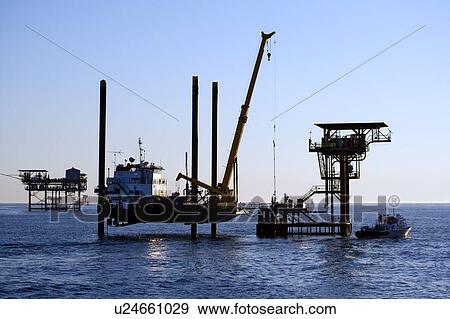 Stock Photo - Liftboat Performing Production Platform Maintenance. Fotosearch