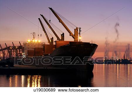 Offloading Cargo from Cargo Ship View Large Photo Image Stock Photo - Offloading Cargo from Cargo Ship. Fotosearch
