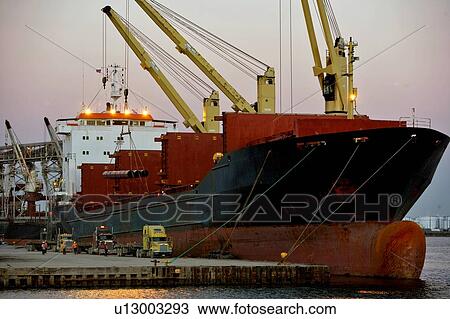 Offloading Pipe from Cargo Ship to Truck View Large Photo Image Stock Image - Offloading Pipe from Cargo Ship to Truck. Fotosearch