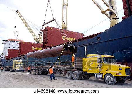 Offloading Pipe from Cargo Ship to Truck View Large Photo Image Stock Photo - Offloading Pipe from Cargo Ship to Truck. Fotosearch