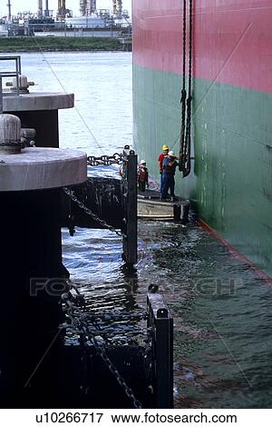 Offshore Crew Handling Ship's Rope from Boat View Large Photo Image Stock Photo - Offshore Crew Handling Ship's Rope from Boat. Fotosearch