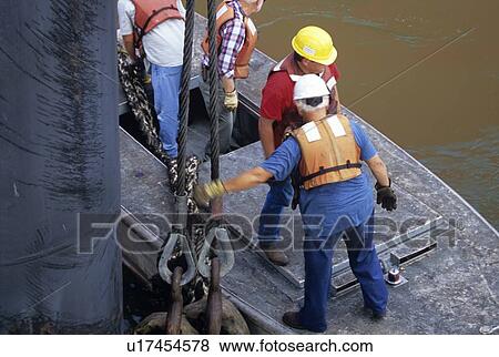 Offshore Crew Handling Ship's Rope from Boat View Large Photo Image Stock Photo - Offshore Crew Handling Ship's Rope from Boat. Fotosearch
