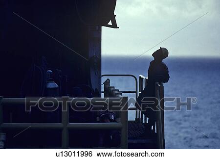 Offshore Drilling Rig Worker Looking Upward View Large Photo Image Stock Photograph - Offshore Drilling Rig Worker Looking Upward. Fotosearch