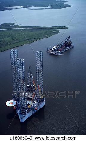 Offshore Oil Drilling Rig and Construction Barge in Inland Waterway View Large Photo Image Stock Photo - Offshore Oil Drilling Rig and Construction Barge in Inland Waterway. Fotosearch
