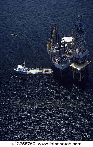 Offshore Oil Drilling Rig and Supply Boat View Large Photo Image Stock Image - Offshore Oil Drilling Rig and Supply Boat. Fotosearch