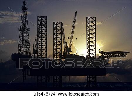 Offshore Oil Drilling Rig at Sunset View Large Photo Image Picture - Offshore Oil Drilling Rig at Sunset. Fotosearch