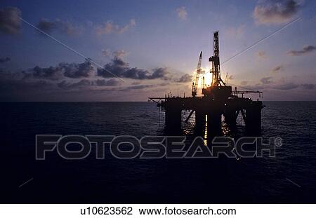 Stock Image - Offshore Oil Drilling Rig at Sunset. Fotosearch