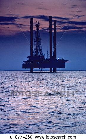 Stock Image - Offshore Oil Drilling Rig at Sunset. Fotosearch