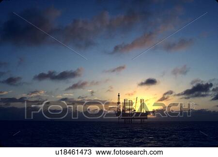 Stock Image - Offshore Oil Drilling Rig at Sunset. Fotosearch