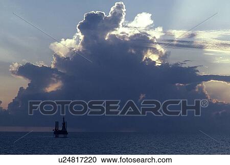 Offshore Oil Drilling Rig at Sunset View Large Photo Image Stock Image - Offshore Oil Drilling Rig at Sunset. Fotosearch