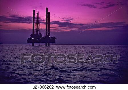 Offshore Oil Drilling Rig at Sunset View Large Photo Image Stock Image - Offshore Oil Drilling Rig at Sunset. Fotosearch