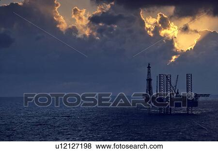 Stock Photo - Offshore Oil Drilling Rig at Sunset. Fotosearch
