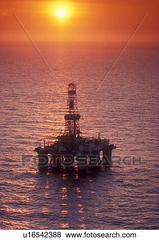 Stock Photo - Offshore Oil Drilling Rig at Sunset. Fotosearch