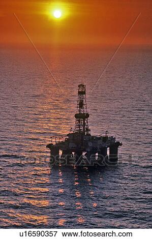 Stock Photo - Offshore Oil Drilling Rig at Sunset. Fotosearch