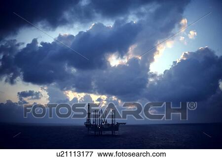 Stock Photo - Offshore Oil Drilling Rig at Sunset. Fotosearch