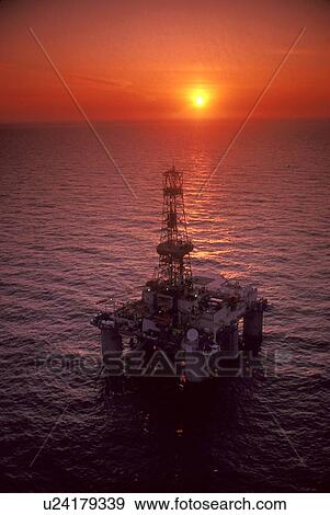 Stock Photo - Offshore Oil Drilling Rig at Sunset. Fotosearch