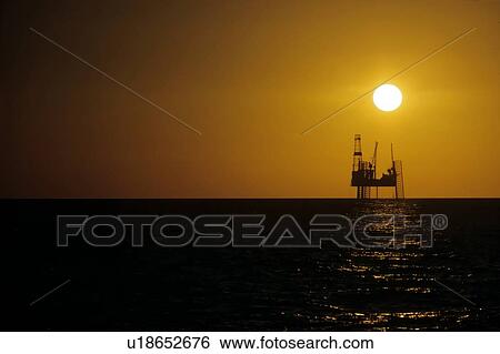 Stock Photograph - Offshore Oil Drilling Rig at Sunset. Fotosearch