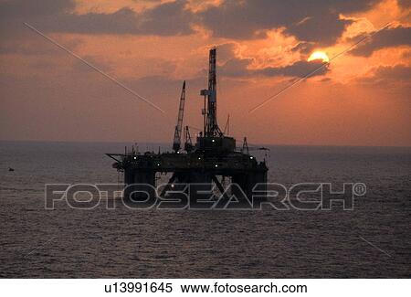 Offshore Oil Drilling Rig at Sunset View Large Photo Image Stock Photography - Offshore Oil Drilling Rig at Sunset. Fotosearch