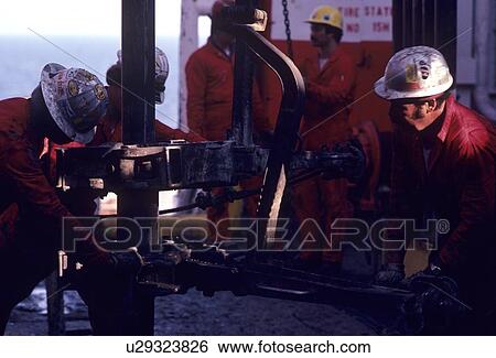 Stock Photograph - Offshore Oil Drilling Rig Crew Working on Drillfloor. Fotosearch