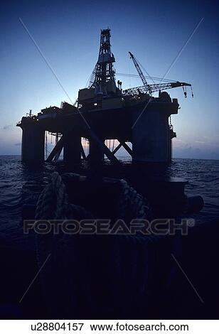 Offshore Oil Drilling Rig Silhouette View Large Photo Image Stock Photo - Offshore Oil Drilling Rig Silhouette. Fotosearch
