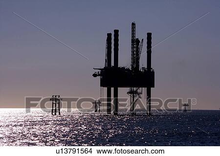 Picture - Offshore Oil Drilling Rig with Water Reflection. Fotosearch