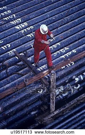 Offshore Oil Drilling Rig Worker Lifting Drill Pipe View Large Photo Image Stock Image - Offshore Oil Drilling Rig Worker Lifting Drill Pipe. Fotosearch