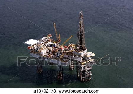 Offshore Oil Drilling Rig Working over Production Platform View Large Photo Image Stock Image - Offshore Oil Drilling Rig Working over Production Platform. Fotosearch