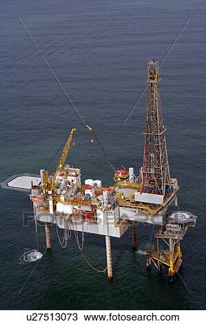Offshore Oil Drilling Rig Working over Production Platform View Large Photo Image Stock Image - Offshore Oil Drilling Rig Working over Production Platform. Fotosearch