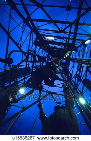 Offshore Oil Rig Derrick and Worker View Large Photo Image Stock Photo - Offshore Oil Rig Derrick and Worker. Fotosearch