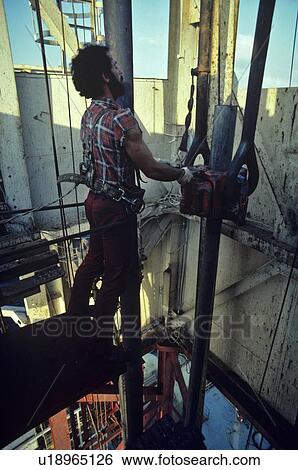 Offshore Oil Rig Worker Handling Drill Pipe in Derrick View Large Photo Image Stock Photograph - Offshore Oil Rig Worker Handling Drill Pipe in Derrick. Fotosearch