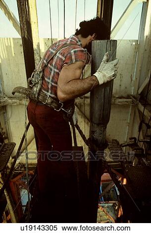 Offshore Oil Rig Worker Handling Drill Pipe in Derrick View Large Photo Image Stock Photography - Offshore Oil Rig Worker Handling Drill Pipe in Derrick. Fotosearch
