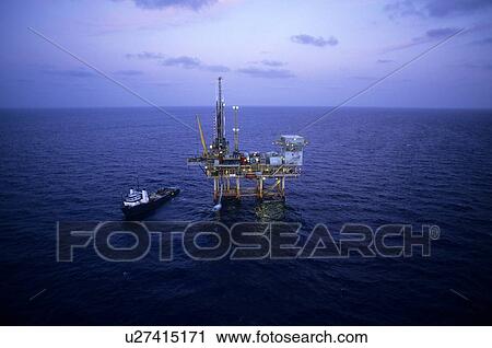 Stock Image - Offshore Production Platform and Supply Boat. Fotosearch
